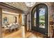 Bright dining room, hardwood floors, brick archway, and detailed entry doors enhance this beautiful home at 1012 Clover Crest Ln, Weddington, NC 28104