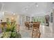 Open-concept living area with dining area and large windows at 1012 Clover Crest Ln, Weddington, NC 28104