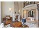 Beautiful home office featuring a stunning stone fireplace, rich wood accents, and elegant lighting at 1012 Clover Crest Ln, Weddington, NC 28104