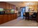 Basement kitchenette and dining area with cabinetry, a microwave, and a table set for dining at 1035 Pee Dee Ave, Albemarle, NC 28001