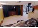 Finished basement with a large TV, comfortable seating, and a wet bar, ideal for entertainment and relaxation at 1035 Pee Dee Ave, Albemarle, NC 28001