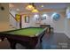 Finished basement featuring a pool table, decor, and lighting perfect for recreation and entertainment at 1035 Pee Dee Ave, Albemarle, NC 28001