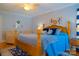 Inviting bedroom featuring a floral comforter, accent pillows and area rug at 1035 Pee Dee Ave, Albemarle, NC 28001