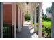 Covered walkway with stone floor and white columns offering a serene outdoor experience at 1035 Pee Dee Ave, Albemarle, NC 28001