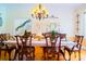 Formal dining room features hardwood floors, wooden chairs and a long set dinner table at 1035 Pee Dee Ave, Albemarle, NC 28001