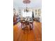 Formal dining room features hardwood floors, wooden chairs and a long set dinner table at 1035 Pee Dee Ave, Albemarle, NC 28001