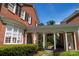 Brick house featuring a walkway connecting to a guest house, showcasing architectural design and landscaping at 1035 Pee Dee Ave, Albemarle, NC 28001