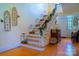Elegant foyer featuring hardwood floors, decorative staircase, and stylish accents at 1035 Pee Dee Ave, Albemarle, NC 28001