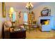Bright living room features neutral tones, fireplace, and elegant chandelier lighting fixture at 1035 Pee Dee Ave, Albemarle, NC 28001