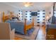 Comfortable main bedroom with an accent rug, a queen-sized bed and ceiling fan at 1035 Pee Dee Ave, Albemarle, NC 28001