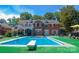 Inviting backyard with a private pool, diving board, and seating, perfect for relaxation and entertainment at 1035 Pee Dee Ave, Albemarle, NC 28001