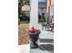Charming porch features rocking chairs, slate flooring, and a decorative cardinal statue, offering a relaxing outdoor space at 1035 Pee Dee Ave, Albemarle, NC 28001