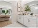 Elegant bathroom with double vanity sinks and a neutral color palette at 1046 Mapletree Ln, Indian Trail, NC 28079