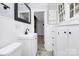 Well-lit bathroom with modern vanity, framed mirror, and ample storage at 105 Deaver St, Chester, SC 29706