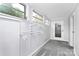 A bedroom has three windows for light and features closet shelving for storage at 105 Deaver St, Chester, SC 29706