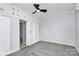 The well-lit bedroom has a ceiling fan and ample storage with built-in cabinets at 105 Deaver St, Chester, SC 29706