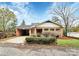 A charming single-story brick home has manicured landscaping and an attached carport at 105 Deaver St, Chester, SC 29706
