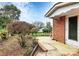 The brick exterior features a patio with a view of the landscaped yard at 105 Deaver St, Chester, SC 29706
