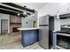 Open kitchen with island and stainless appliances, offering a modern cooking space at 105 Deaver St, Chester, SC 29706