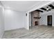 Open living room with brick fireplace, ceiling fan, and lots of natural light at 105 Deaver St, Chester, SC 29706