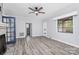 Bright living room with ceiling fan, large window, and paneled walls at 105 Deaver St, Chester, SC 29706