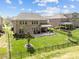 Large, well-maintained backyard with a patio, black metal fence, and lush landscaping at 10904 Kilkenny Dr, Matthews, NC 28105