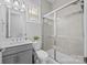 Bathroom featuring a glass door shower, white toilet, and gray vanity at 10904 Kilkenny Dr, Matthews, NC 28105