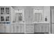 Bathroom featuring dual sinks, white cabinets, and vanity at 10904 Kilkenny Dr, Matthews, NC 28105