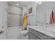 Functional bathroom with a tub-shower, ample storage and tile flooring at 10904 Kilkenny Dr, Matthews, NC 28105