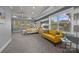 Bedroom with natural light and yellow couch at 10904 Kilkenny Dr, Matthews, NC 28105