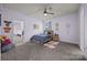 Charming bedroom with a cozy bed, playful decorations, and comfortable carpet flooring at 10904 Kilkenny Dr, Matthews, NC 28105