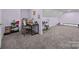 Versatile bonus room featuring a desk, keyboard, and ample space for hobbies and activities at 10904 Kilkenny Dr, Matthews, NC 28105