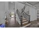 Grand two-story foyer with hardwood floors and staircase at 10904 Kilkenny Dr, Matthews, NC 28105
