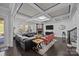 Bright living room with fireplace, coffered ceiling and ample seating at 10904 Kilkenny Dr, Matthews, NC 28105