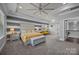 Spacious bedroom with tray ceilings, sitting area, and ensuite bath at 10904 Kilkenny Dr, Matthews, NC 28105