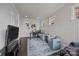Comfortable home office with stylish wallpaper, a modern desk, and two cozy armchairs at 10904 Kilkenny Dr, Matthews, NC 28105