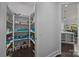 Walk-in pantry with shelving for ample storage and organization at 10904 Kilkenny Dr, Matthews, NC 28105