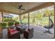 Relaxing covered patio with comfortable seating and view of the expansive lawn at 10904 Kilkenny Dr, Matthews, NC 28105