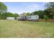 Spacious backyard offers ample space for outdoor activities and features mature trees and grass at 115 Oak Creek Rd, Statesville, NC 28625