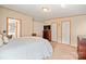 Neutral bedroom with a comfortable bed, closet, TV, and ensuite bathroom at 115 Oak Creek Rd, Statesville, NC 28625