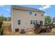Wide backyard view showcasing the deck with stairs and additional backyard space in a home's exterior at 116 Rainbow Trout Trl, Fort Mill, SC 29715