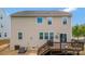 Spacious backyard featuring a wooden deck with barbecue, perfect for outdoor living and entertaining at 116 Rainbow Trout Trl, Fort Mill, SC 29715