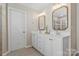 Bright bathroom with double sinks, framed mirrors, and vanity with drawers and cabinets at 116 Rainbow Trout Trl, Fort Mill, SC 29715