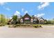 A beautifully landscaped clubhouse featuring traditional architecture and lush green surroundings at 116 Rainbow Trout Trl, Fort Mill, SC 29715