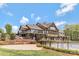 Impressive community clubhouse with fenced pool, beautiful landscaping, and expansive entertaining space at 116 Rainbow Trout Trl, Fort Mill, SC 29715