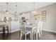 Cozy dining area features modern lighting and hardwood floors, adjacent to kitchen at 116 Rainbow Trout Trl, Fort Mill, SC 29715