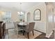 Formal dining room with elegant chandelier, wainscoting, and comfortable seating for six at 116 Rainbow Trout Trl, Fort Mill, SC 29715