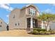 Inviting two-story home with charming front porch, beautiful landscaping, and a well-maintained yard at 116 Rainbow Trout Trl, Fort Mill, SC 29715