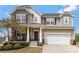 Charming two-story home with stone accents, covered porch and manicured landscaping at 116 Rainbow Trout Trl, Fort Mill, SC 29715