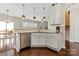Bright kitchen features granite counters, stainless appliances, and hardwood floors at 116 Rainbow Trout Trl, Fort Mill, SC 29715